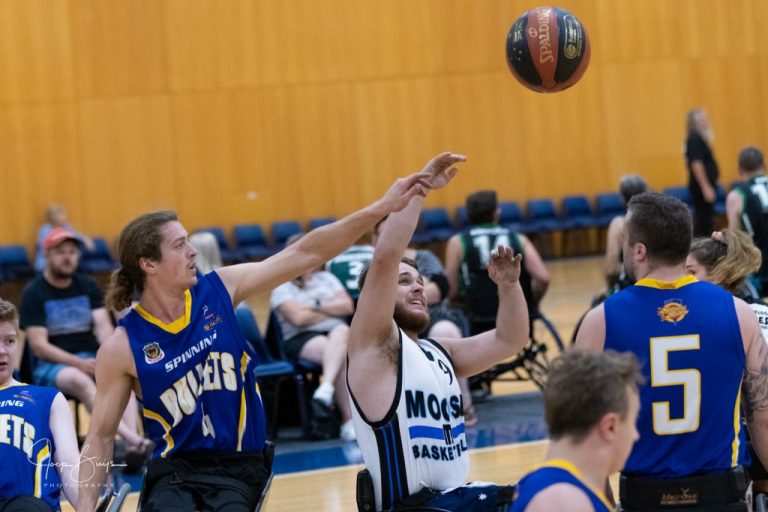 Ball in the air with two players reaching for it